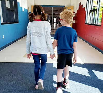 two students walking at JRE