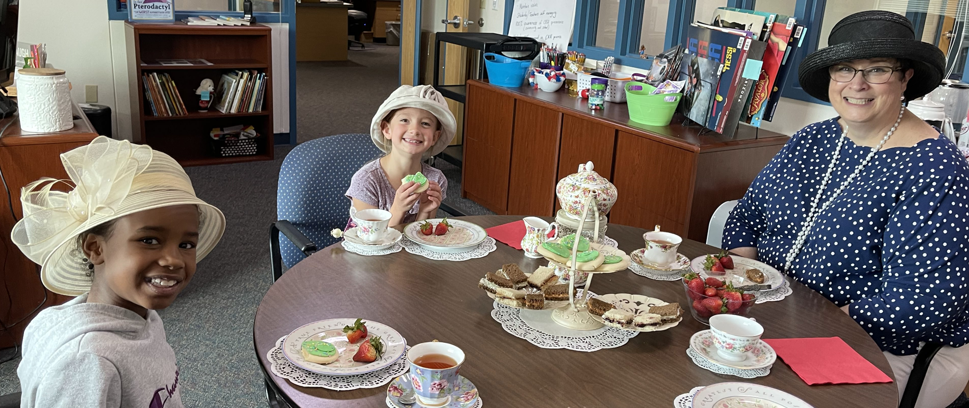 Principal Yates having a tea party with students